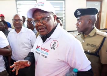 Tanzanian opposition leader and former presidential candidate of CHADEMA party Tundu Lissu is escorted as he walks at the Kisutu Resident Magistrate Court in Dar es Salaam, Tanzania April 10, 2025.