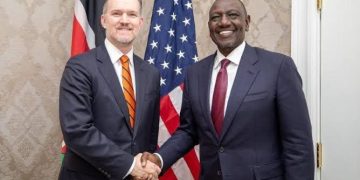 Kenyan and U.S. officials shake hands, symbolizing renewed trade cooperation under the AGOA extension.